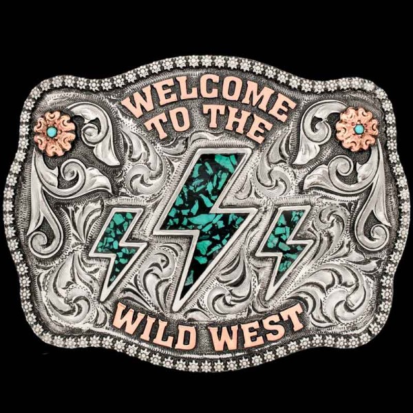 "Welcome to the Wild West! The Sonora Custom Buckle will add a little bit of cowgirl to any outfit. Crafted on a hand-engraved, German Silver base with a light antique finish. Detailed with a beautiful berry edge, copper flowers and western-style let